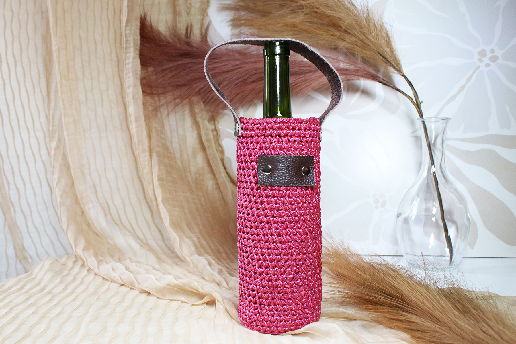 Porte-bouteille en tricot avec dragonne en cuir