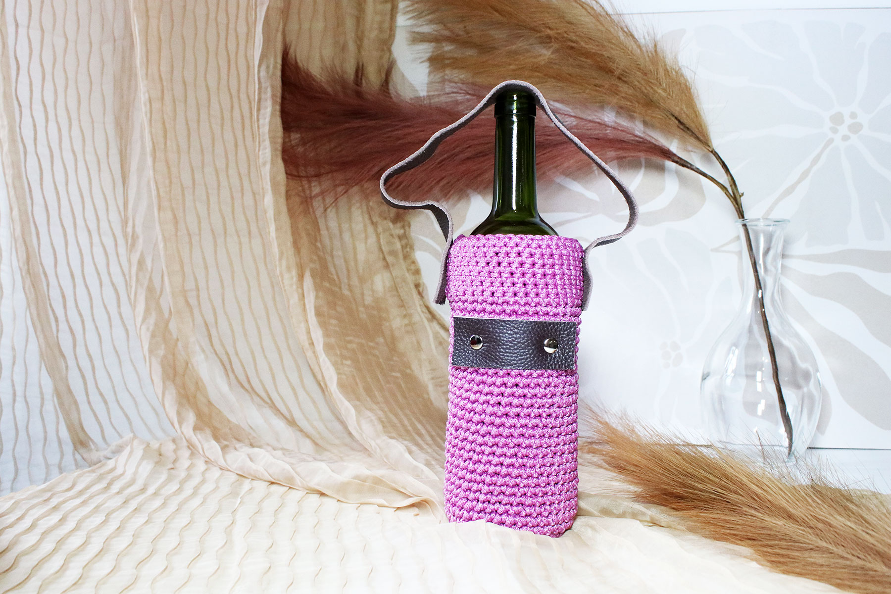 Porte-bouteille en tricot avec dragonne en cuir