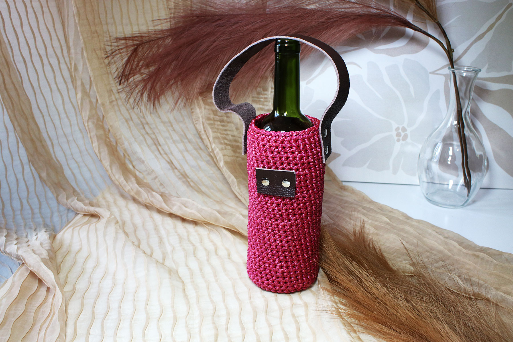 Porte-bouteille en tricot avec dragonne en cuir