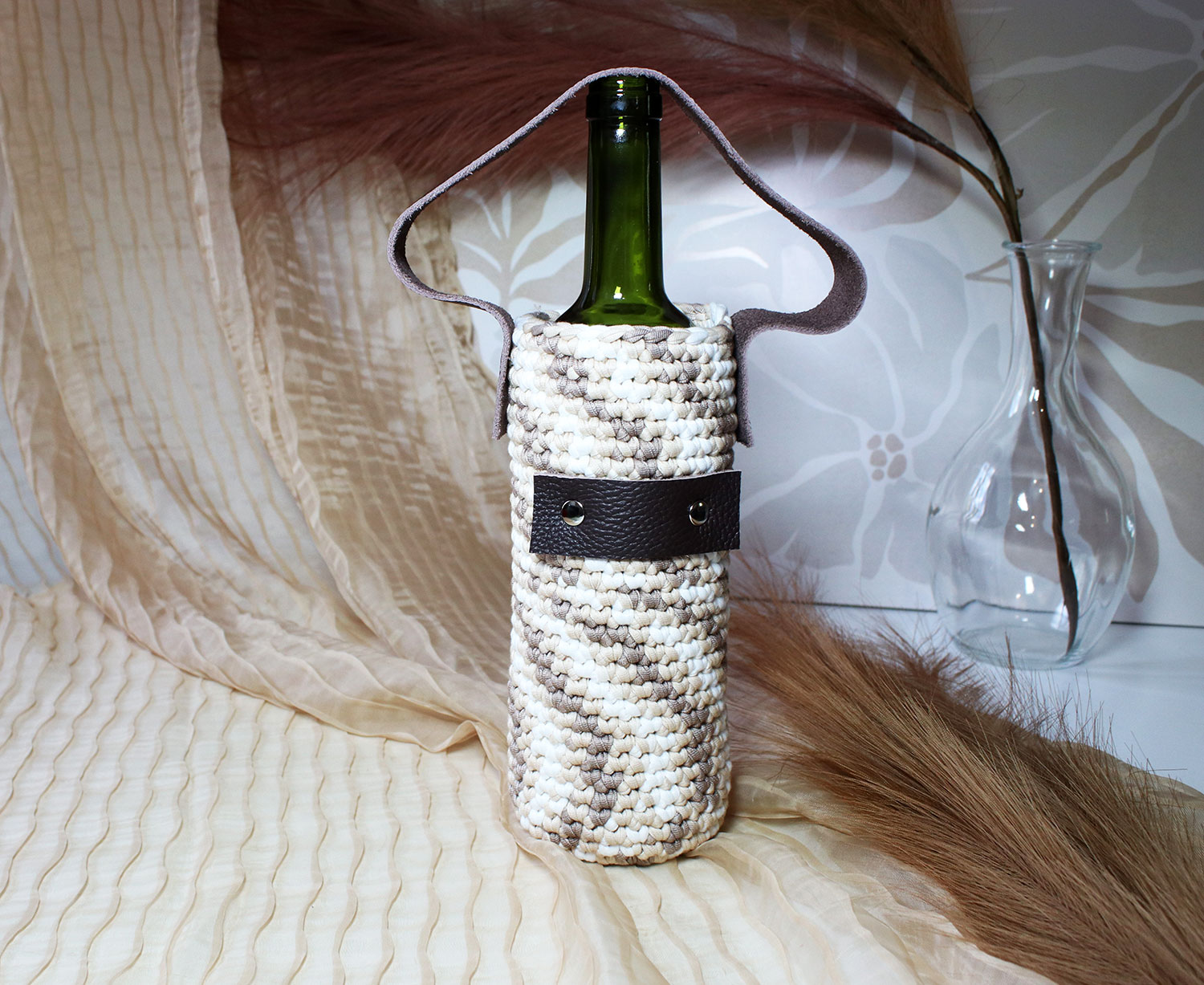 Porte-bouteille en tricot avec dragonne en cuir