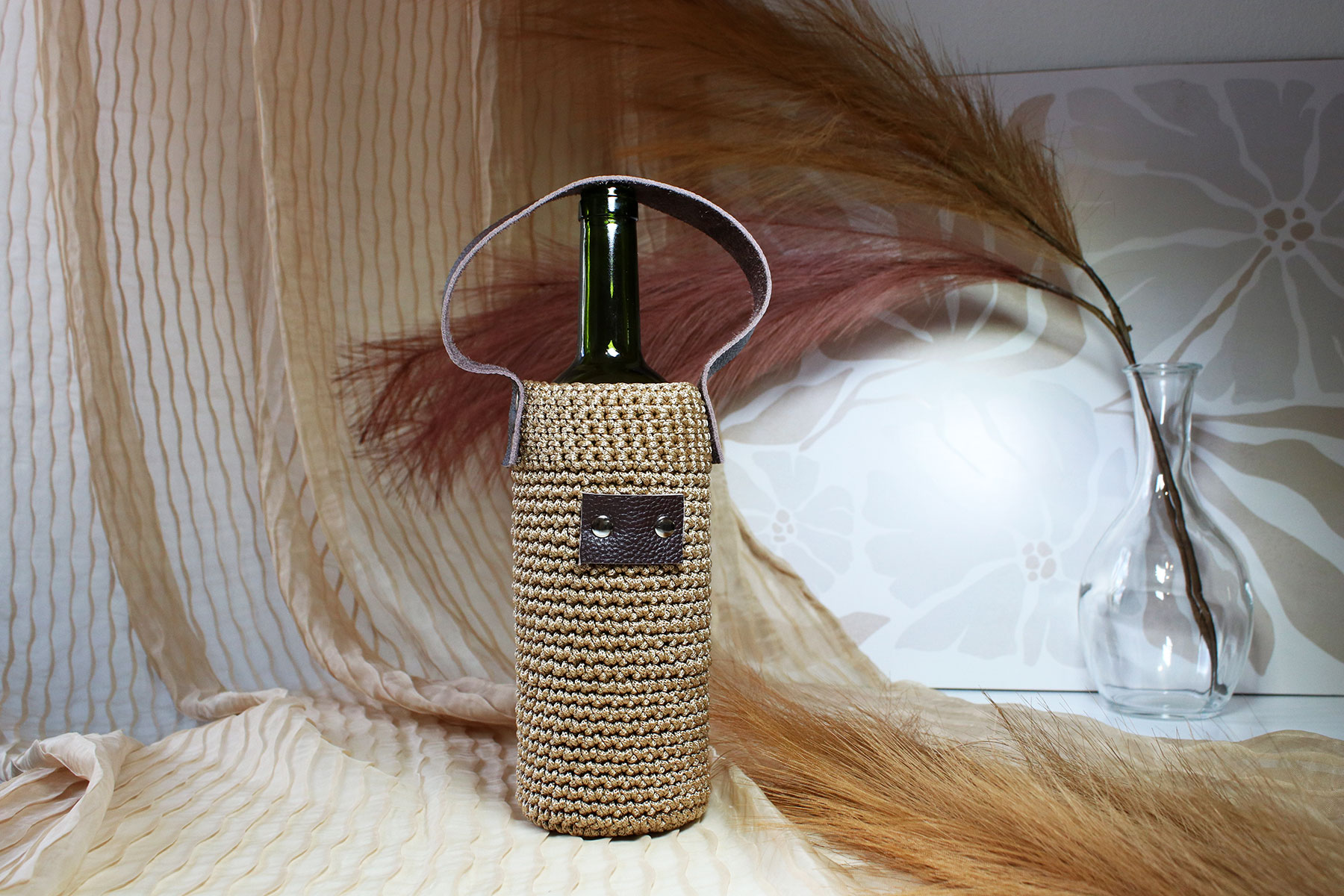 Porte-bouteille en tricot avec dragonne en cuir